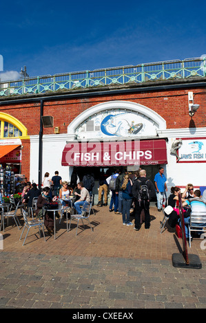 People queing at a fish and chip shop on Brighton seafront Stock Photo
