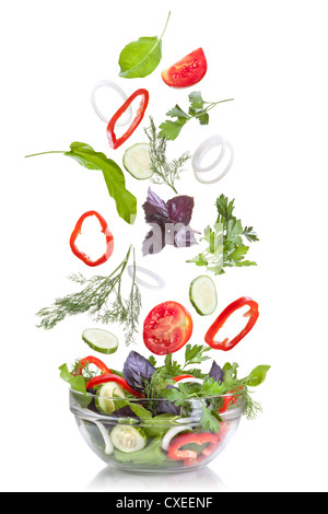 Falling vegetables for salad isolated on white Stock Photo