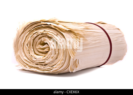 Old rolled blank parchment paper roll vertical on white background, with  drop shadow Stock Photo - Alamy