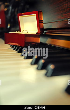 Wedding rings on the piano Stock Photo