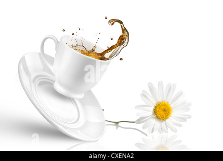 Splash of tea in the falling cup with flower isolated on white Stock Photo