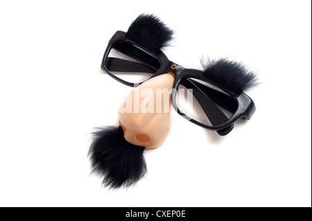 A set of 'Groucho Marx' glasses with nose, mustache and eyebrows on a white background. Funny glasses with nose Stock Photo