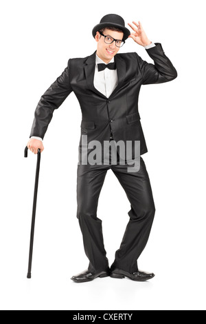 Full length portrait of a man holding a cane and gesturing isolated on white background Stock Photo