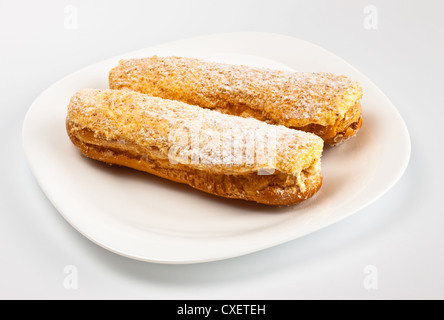 two eclairs on white dish Stock Photo