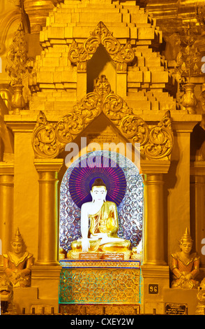 BUDDHA STATUES are worshipped at the SHWEDAGON PAYA or PAGODA which dates from 1485 - YANGON, MYANAMAR Stock Photo