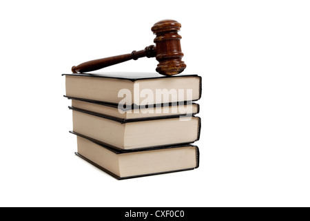 Judge's brown wooden gavel on a stack of books Stock Photo