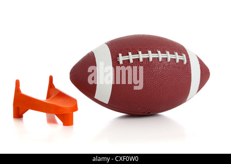 American football and a kicking tee on a white background Stock Photo