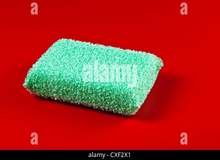 green sponge on red background