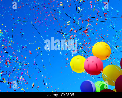 multicolored balloons and confetti in the city festival Stock Photo