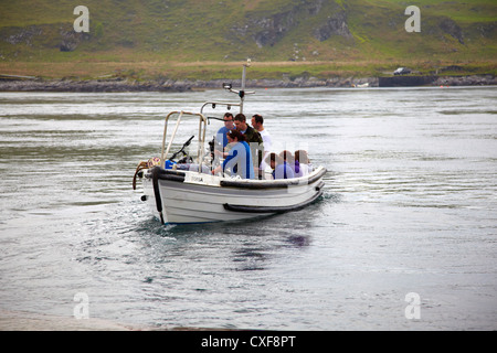 Ferry from Cuan Ferry leaving with pedestrians and cyclists crossing Cuan Sound to Luing Stock Photo