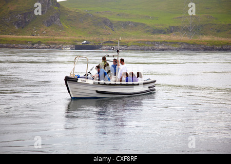 Ferry from Cuan Ferry leaving with pedestrians and cyclists crossing Cuan Sound to Luing Stock Photo