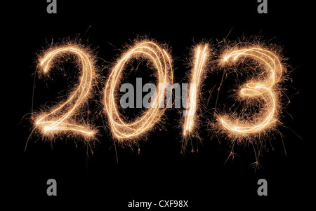 Number 2013 written with real sparklers on black background. Stock Photo