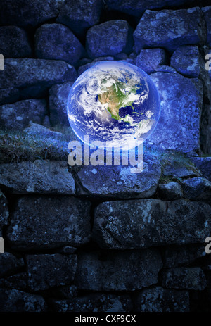 Planet earth on an old castle wall. Earth image provided by NASA. Stock Photo
