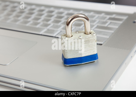Padlock on a computer keyboard Stock Photo