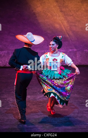 Dancers in traditional Mexican dress at Xcaret Mexico Espectacular dinner show; Xcaret theme park, Riviera Maya, Mexico. Stock Photo