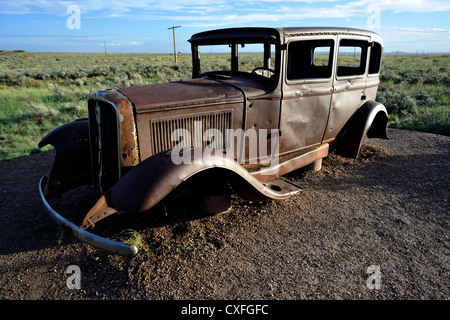 Abandoned rusted car on Route 66, Petrified Forest National Park in Arizona, USA Stock Photo