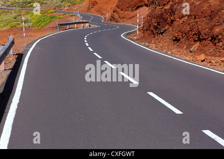 Canary Islands winding road curves in red mountain Stock Photo