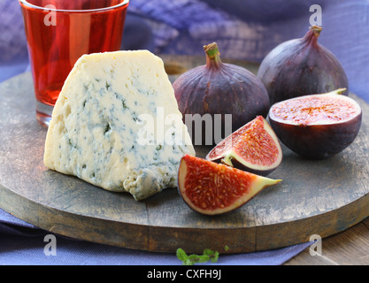 cheese and sweet fruit  figs on a wooden board Stock Photo