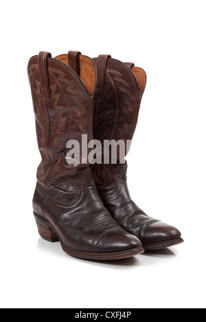 a Pair of worn leather cowboy boots on a white background Stock Photo