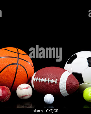 Assorted sports balls on a black background Stock Photo: 50746144 - Alamy