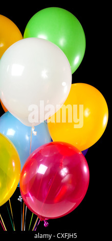Bouquet of various colored balloons on a black background Stock Photo
