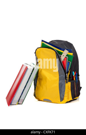Yellow backpack with school books on a white background Stock Photo