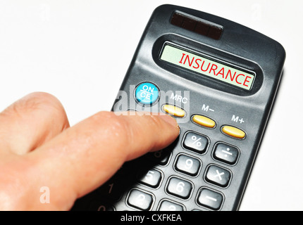 Insurance word on calculator Stock Photo