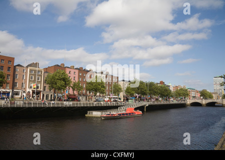 Dublin City Eire View across River Liffey to tree lined Batchelor's Walk Stock Photo