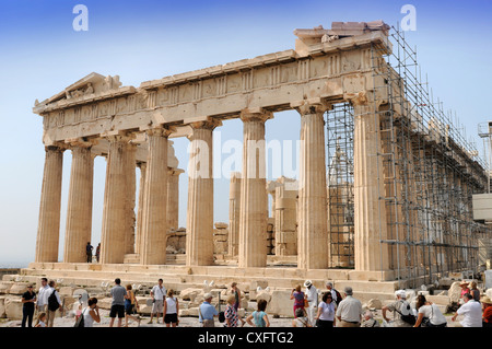 Tourists view the Parthenon temple undergoing restoration work on the Acropolis in Athens, Greece Stock Photo