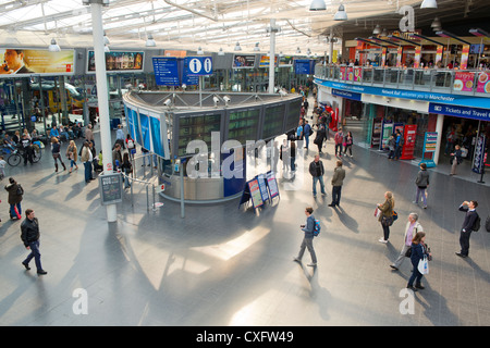 The inside foyer of Manchester Piccadilly railway train station on a sunny day. Stock Photo