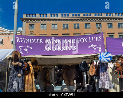 Controversial sign on Helsinki harbour market stall promoting mink, fox ,reindeer furs and knives! Finland Stock Photo