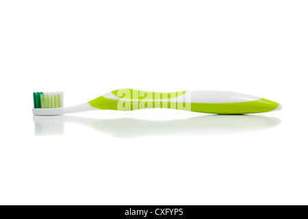 A lime green toothbrush on a white background Stock Photo - Alamy