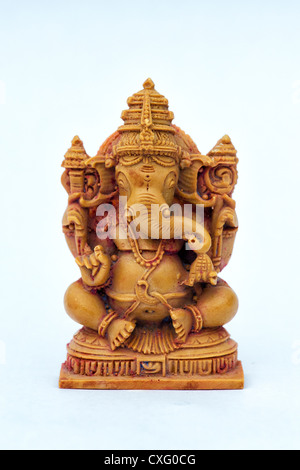 Hindu Elephant God. Lord Ganesha statue against white background Stock Photo