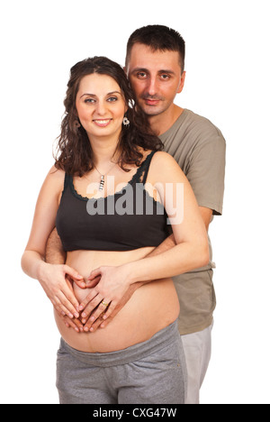 Loving future parents make heart shape with hands on pregnant tummy Stock Photo