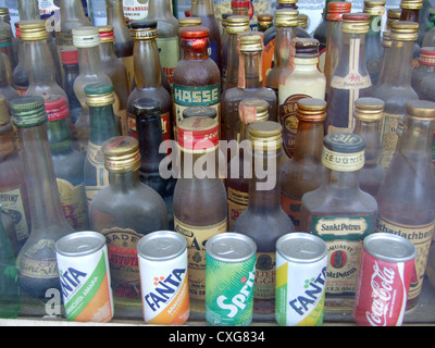 Berlin, dusty liquor bottles in a shop window Stock Photo