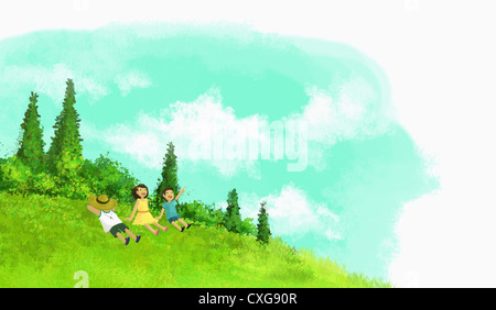 kids lying on the hill and looking up the sky Stock Photo