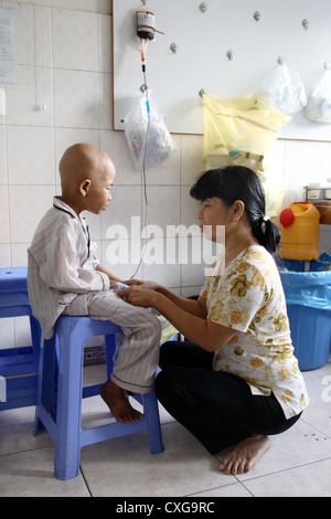 Mother with her child in a chemotherapy on a cancer ward Stock Photo