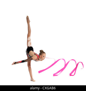 teenager doing gymnastics split with ribbon Stock Photo