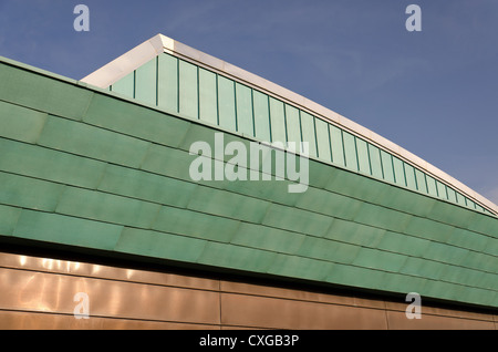 Modern experimental roof design mixing copper and aluminum sheeting overlapping like clay roofing tiles Stock Photo