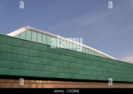 Modern experimental roof design mixing copper and aluminum sheeting overlapping like clay roofing tiles Stock Photo