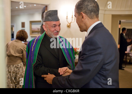 US President Barack Obama shakes hands with President Hamid Karzai of Afghanistan at the White House May 12, 2010 in Washington, DC. Stock Photo