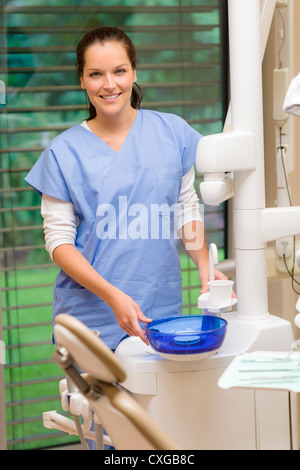 Female dentist assistant at modern dental surgery smiling portrait Stock Photo