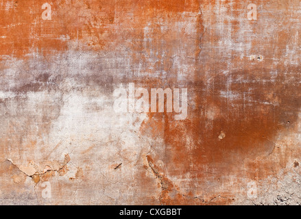 Facade (texture/Backround) of an old Tuscan house with some cracks in the plaster. Stock Photo