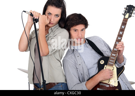 Couple rocking in a band Stock Photo