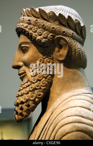 Colossal statue of a bearded man with laurel wreath. Probably a priest. Limestone. From the Sanctuary of Apollo at Idalion. Stock Photo