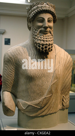 Colossal statue of a bearded man with laurel wreath. Probably a priest. Limestone. From the Sanctuary of Apollo at Idalion. Stock Photo