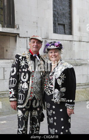 The Pearly Kings & Queens Costermongers’ Harvest Festival held at Guildhall Yard, & St Mary-le-Bow Church, London, England, UK Stock Photo