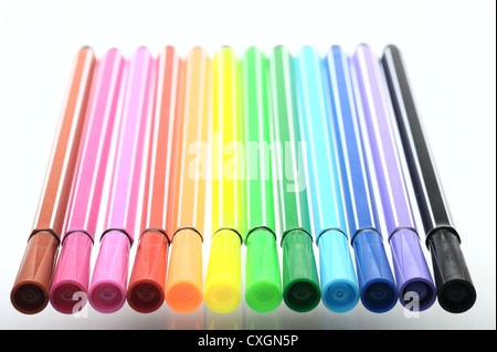 Multi-colored felt pen and their reflection in the glass surface, isolated Stock Photo