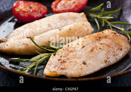 Fish fillet with fresh herbs Stock Photo