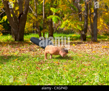 yoga Padma mayurasana pose Stock Photo